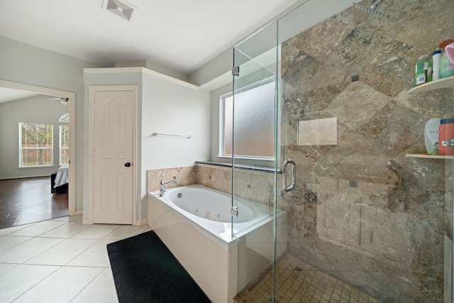 bathroom featuring tile patterned floors and independent shower and bath