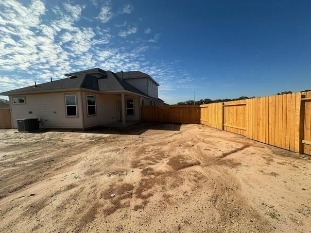 back of property with central air condition unit