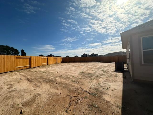 view of yard featuring central AC unit