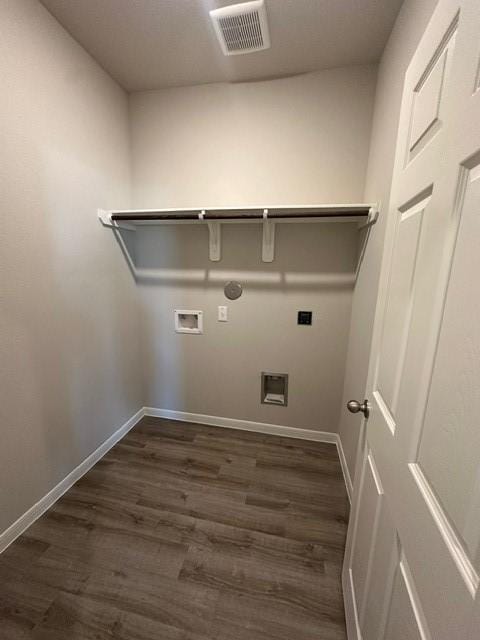 washroom featuring washer hookup, dark hardwood / wood-style flooring, and electric dryer hookup