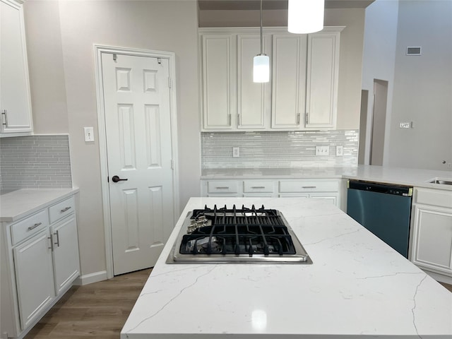 kitchen with white cabinetry, decorative light fixtures, and appliances with stainless steel finishes