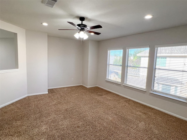 carpeted empty room with ceiling fan