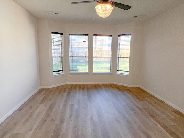 empty room featuring light hardwood / wood-style floors and ceiling fan