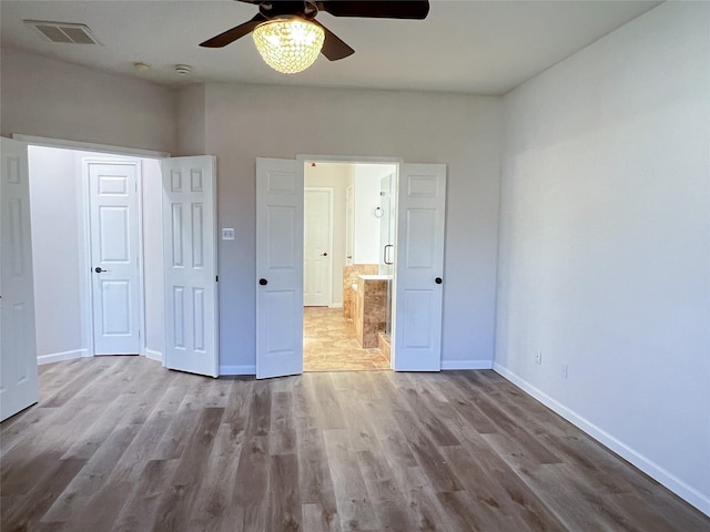 unfurnished bedroom featuring ceiling fan and light hardwood / wood-style floors