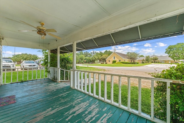 wooden deck with ceiling fan and a porch