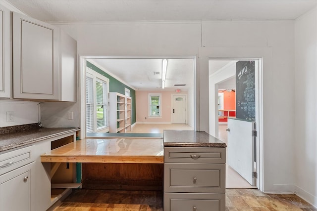 kitchen featuring gray cabinets and ornamental molding