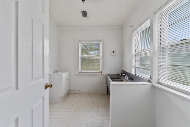 washroom with a textured ceiling