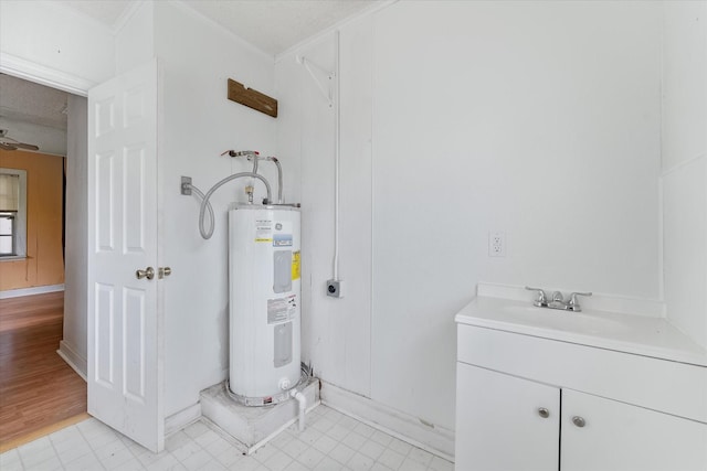 utility room featuring sink and water heater