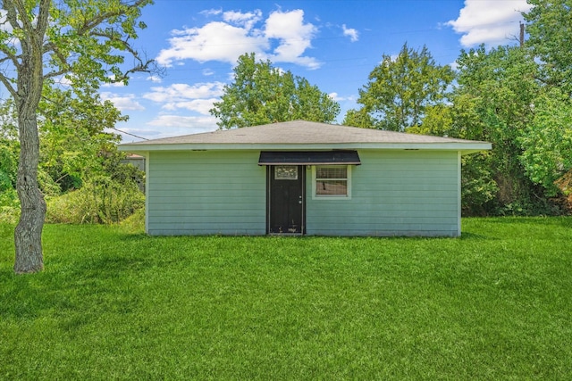 view of outdoor structure with a lawn