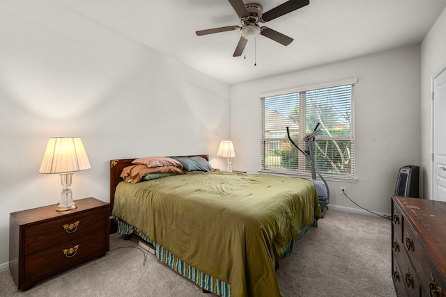 bedroom featuring light colored carpet and ceiling fan