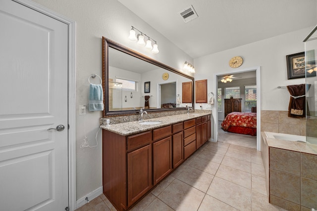 bathroom featuring ceiling fan, tile patterned flooring, and vanity