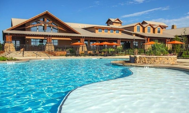 view of pool featuring a patio