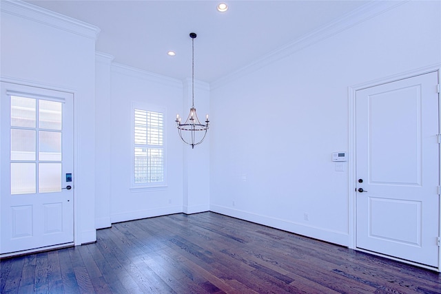 entryway featuring ornamental molding, dark wood-type flooring, and an inviting chandelier