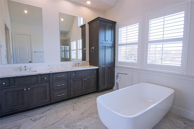 bathroom featuring plus walk in shower and vanity