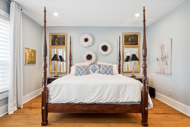 bedroom with light hardwood / wood-style floors