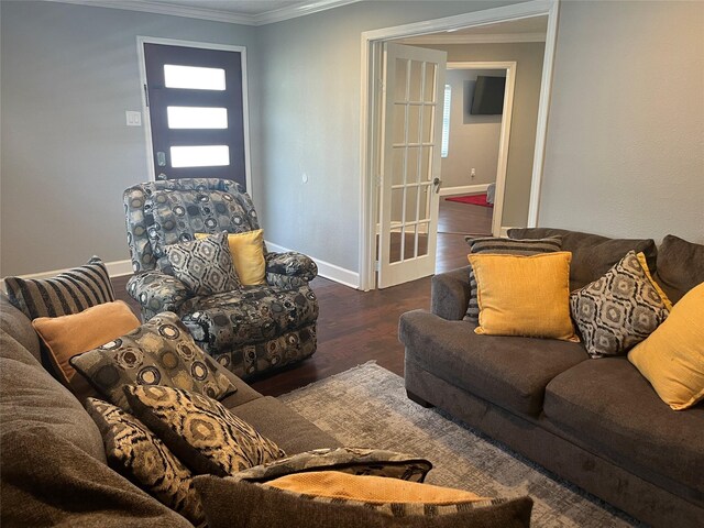 living room with french doors, dark hardwood / wood-style floors, and crown molding