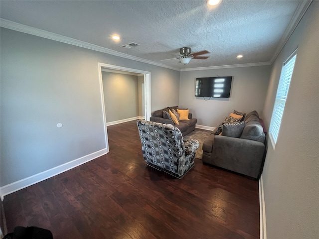 living room with a textured ceiling, dark hardwood / wood-style flooring, ceiling fan, and ornamental molding