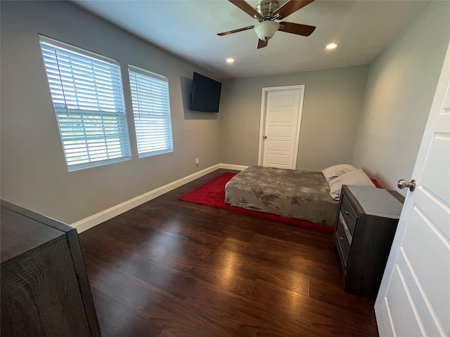 bedroom with dark wood-type flooring and ceiling fan