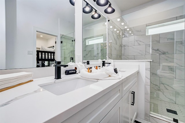 bathroom featuring vanity and a shower with shower door