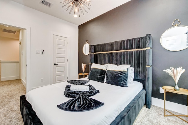 carpeted bedroom with a chandelier