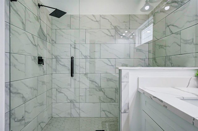 bathroom featuring vanity and a shower with shower door