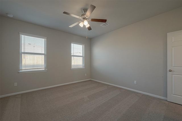 carpeted empty room with ceiling fan