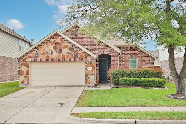 view of front of property with a garage and a front lawn