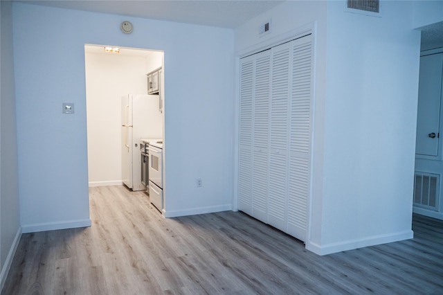 hallway featuring light hardwood / wood-style flooring