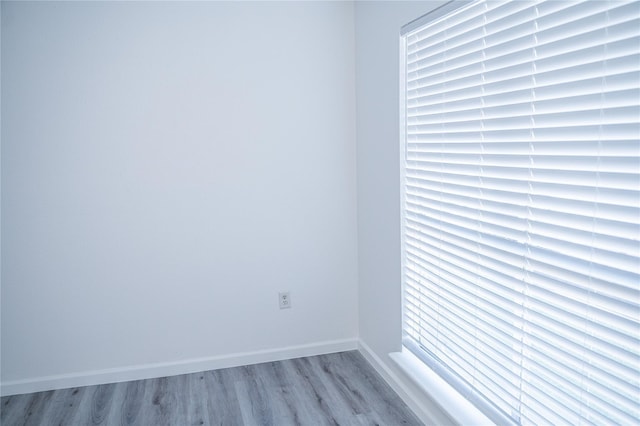 empty room with light hardwood / wood-style flooring