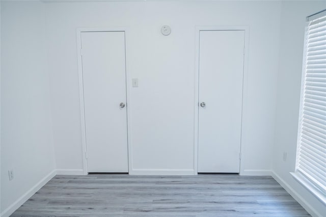 unfurnished bedroom featuring light wood-type flooring