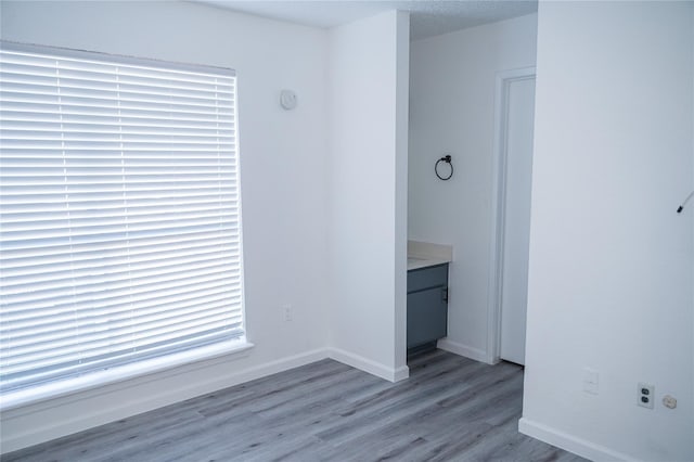 spare room with light hardwood / wood-style flooring