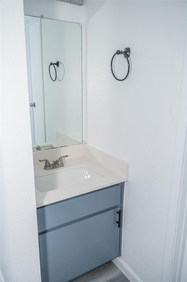 bathroom featuring vanity and hardwood / wood-style flooring