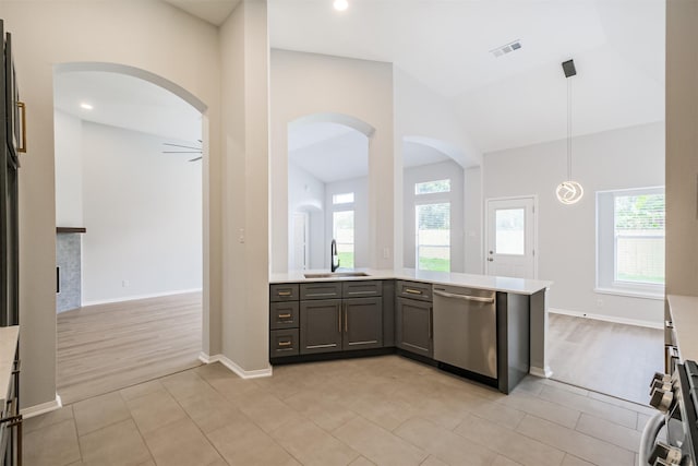 kitchen with kitchen peninsula, ceiling fan, sink, dishwasher, and hanging light fixtures