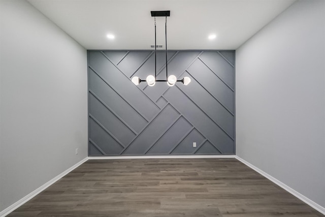 unfurnished dining area with dark hardwood / wood-style floors