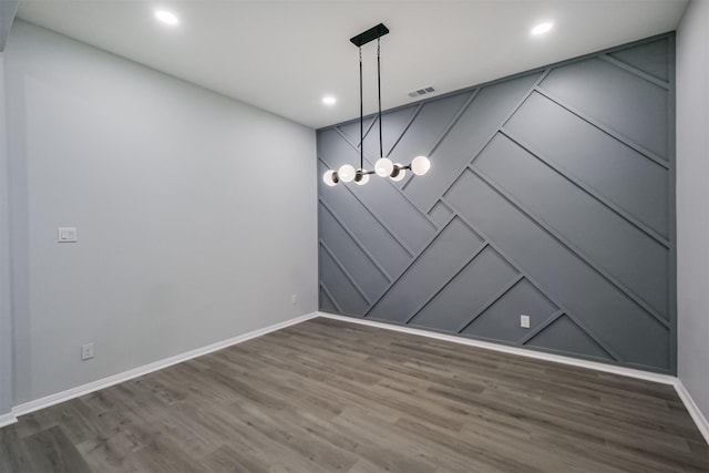 unfurnished dining area with dark wood-type flooring