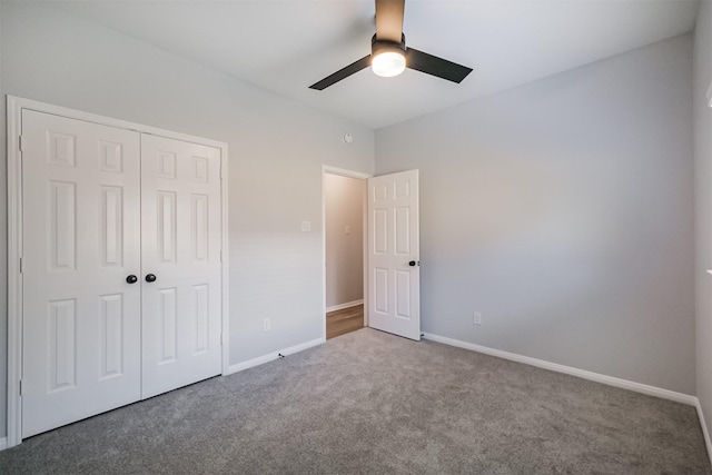 unfurnished bedroom featuring ceiling fan, carpet floors, and a closet