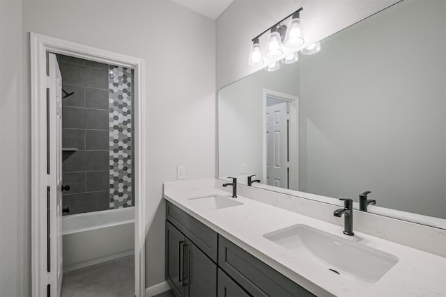 bathroom with vanity and tiled shower / bath