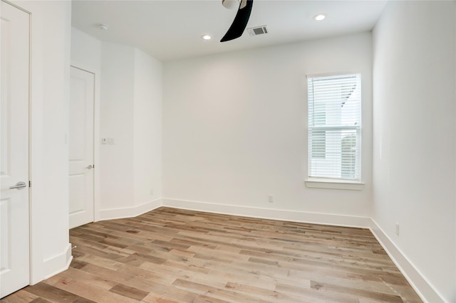 spare room featuring light hardwood / wood-style floors