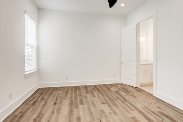 empty room featuring plenty of natural light and light hardwood / wood-style floors