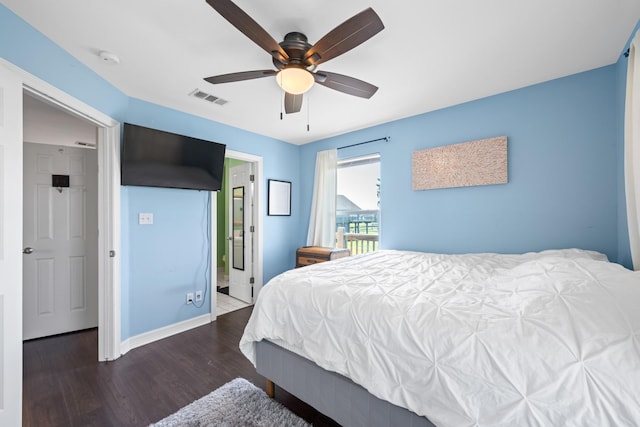 bedroom with ceiling fan and dark hardwood / wood-style floors