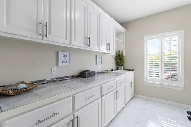 kitchen featuring white cabinets