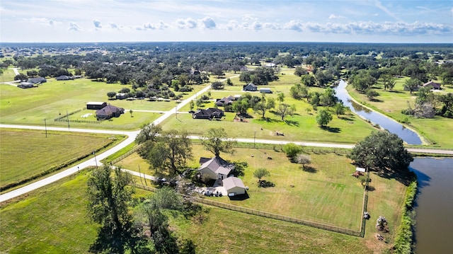 drone / aerial view featuring a water view and a rural view