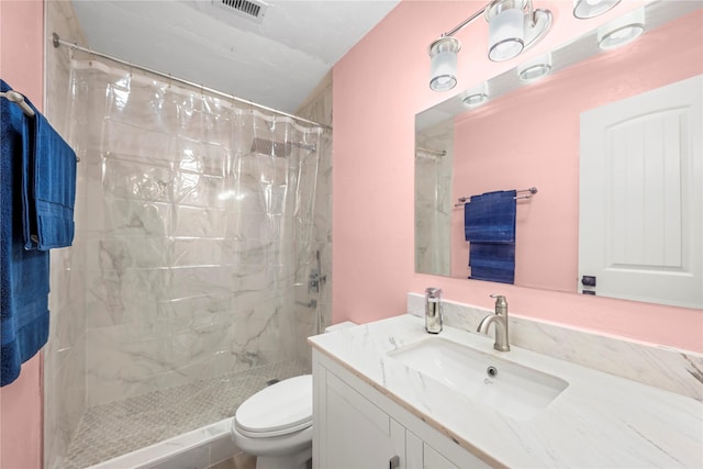 bathroom with a shower with curtain, vanity, and toilet