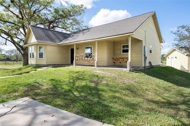 view of front of house featuring a front yard and a porch