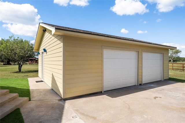 garage with a yard