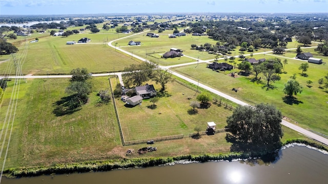 birds eye view of property with a water view and a rural view