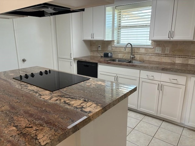 kitchen featuring white cabinets, black appliances, sink, light tile patterned floors, and extractor fan