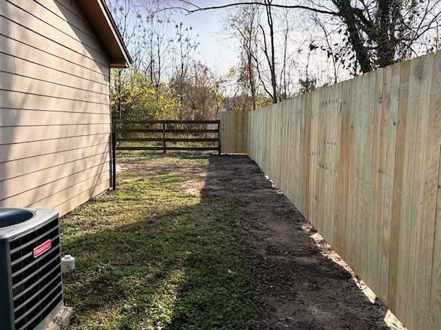 view of yard featuring central AC unit