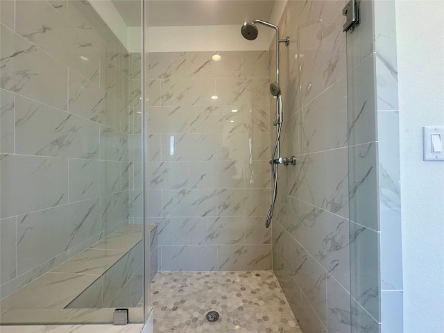 bathroom with tiled shower