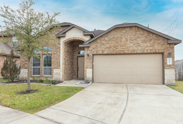 view of front of home with a garage and a front yard